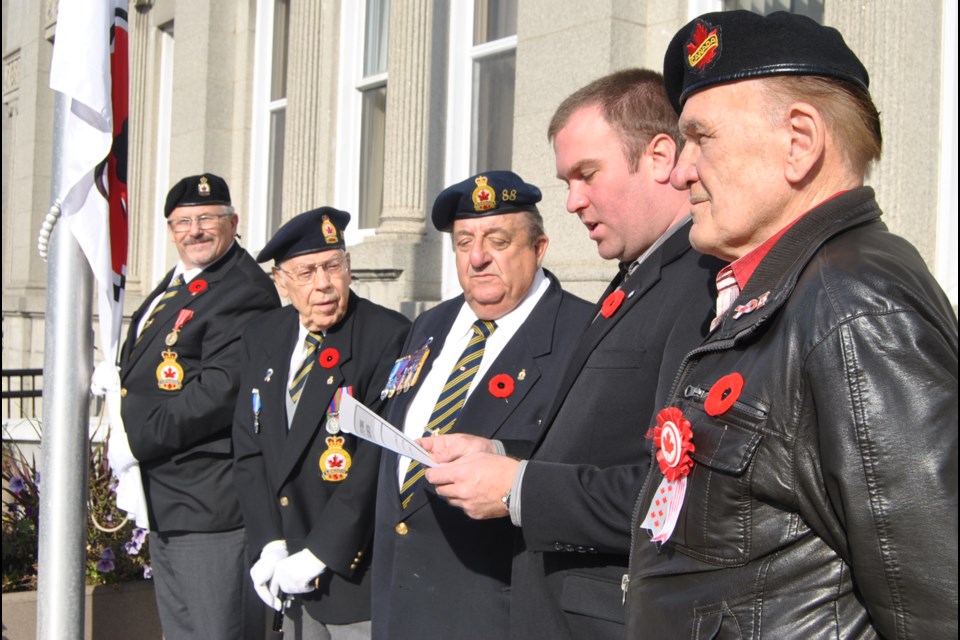 Mayor Steve Black (second from right) reads proclamation of Poppy Week in Timmins Oct. 28 to Nov. 10. He is  flanked by Canadian veterans. Frank Giorno for TimminsToday