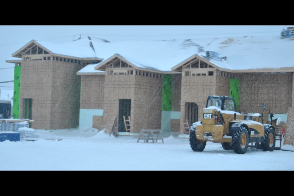 Despite the often below freezing weather, snow, freezing rain, and short winter days, the 18 apartment units being developed on the old athletic fields south of the Timmins Native Friendship Centre  are proceeding rapidly. Frank Giorno for TimminsToday.