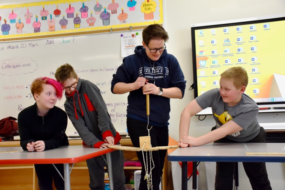 For National Engineering Month, Grade 5 students at Ecole Publique Lionel-Gauthier built Popsicle stick bridges. To see what team's structure was the strongest, members of the Porcupine Kapuskasing Chapter of the Professional Engineers of Ontario stopped by the school to test them out. Maija Hoggett/TimminsToday