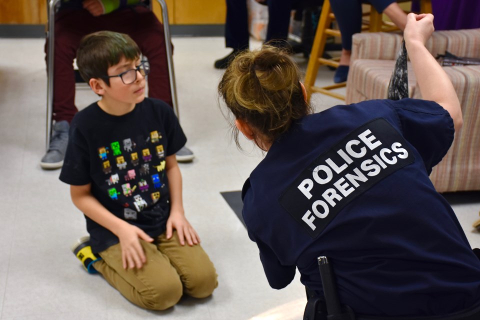 Roland Michener students learn about forensics during a presentation from Timmins Police Const. Erin Halt. Maija Hoggett/TimminsToday