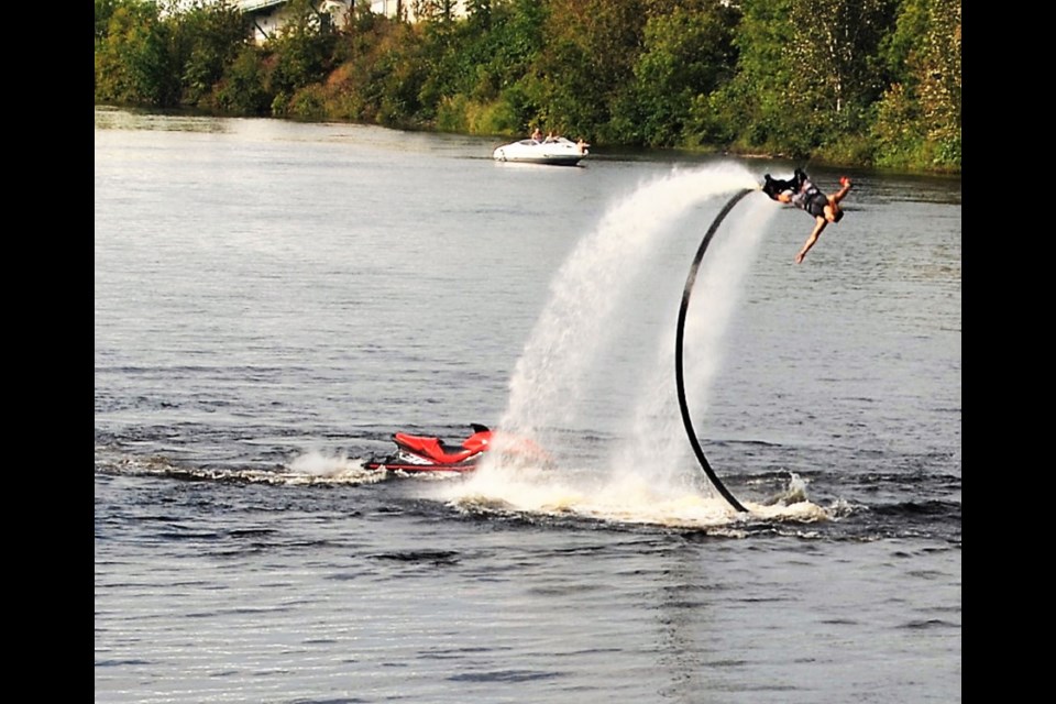 Sam Cowley, flyboard master with Summer Water Sports, performs a water jet aided flip. Frank Giorno for TimminsToday.