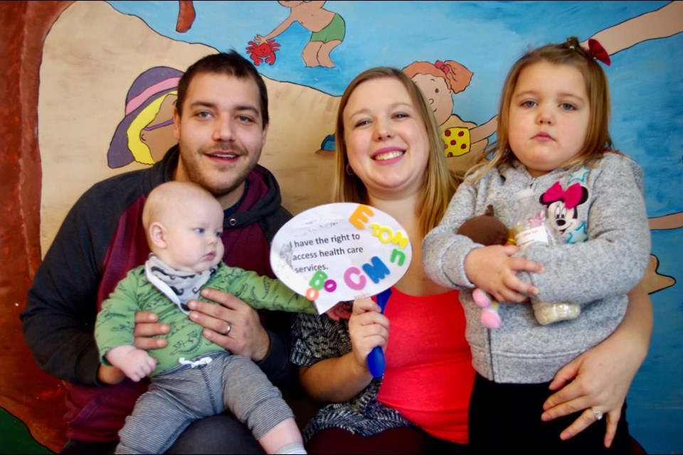 Daniel and Kaytlan Lascelle, along with five-month-old Emersyn and three-year-old Audrey celebrate National Child Day at the Timmins Ontario Early Years Centre. Maija Hoggett/TimminsToday