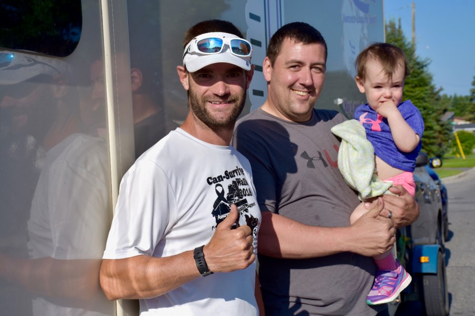 Jimmy Lefebvre with Sebastien Vermette of the Co-operators and 19-month-old Leah. Maija Hoggett/TimminsToday