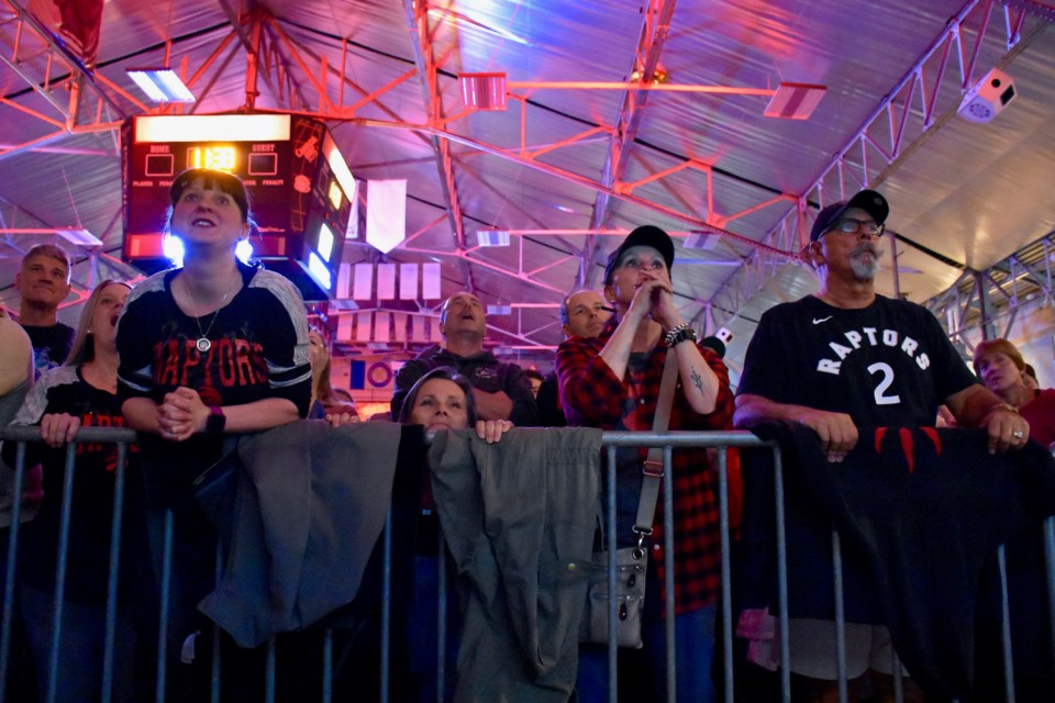 Fans watch the last couple of minutes of game five's action at the McIntyre Arena. Maija Hoggett/TimminsToday