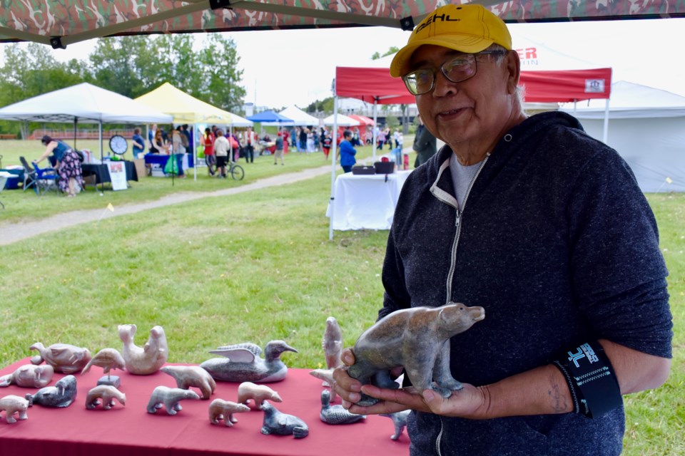 Artist John Etherington is set up at Participark for National Indigenous Peoples Day. He makes tamarack birds, soapstone carvings and paintings. Maija Hoggett/TimminsToday