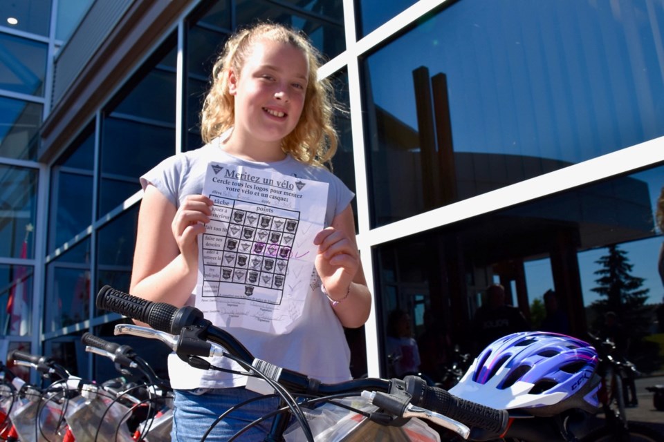 St. Jude student Bella Crane shows the task sheet she completed to earn a bicycle through the Build a Bike program. Maija Hoggett/TimminsToday