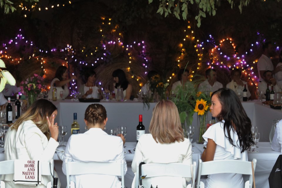 Guests assemble at a farm on Dalton Road for the annual 'Dinner in White' event hosted by Radical Gardens. Andrew Autio for TimminsToday