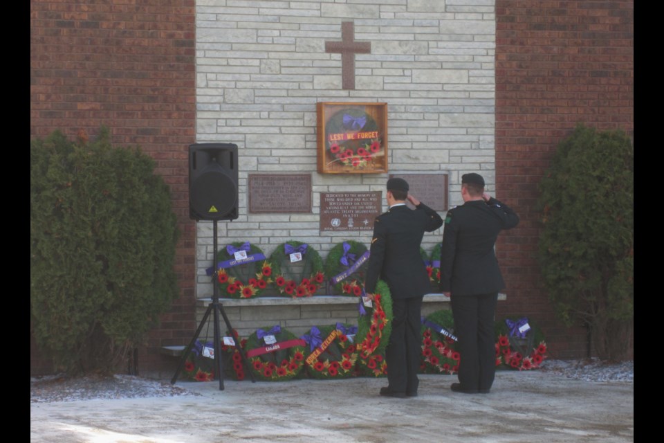 Two servicemen salute during Friday morning's wreath laying ceremonies at Branch 287 of the Royal Canadian Legion. Andrew Autio for TimminsToday                         