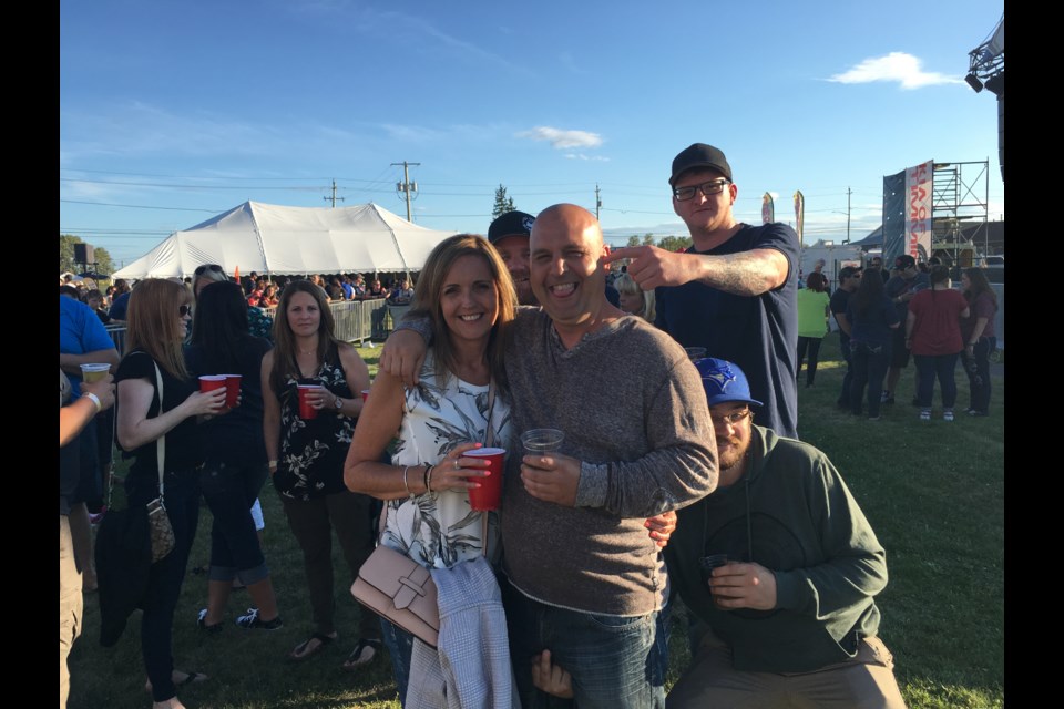 Fans were in good spirits on Friday night at Participark for the return of the Rock on The River festival. Kristie Daly Booker and Dan Martel are surrounded by Allan Beard, Ryan Jones, and Brad Beard. Andrew Autio for TimminsToday