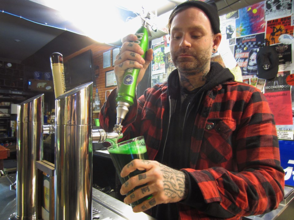 Cayen pours Green Beer
