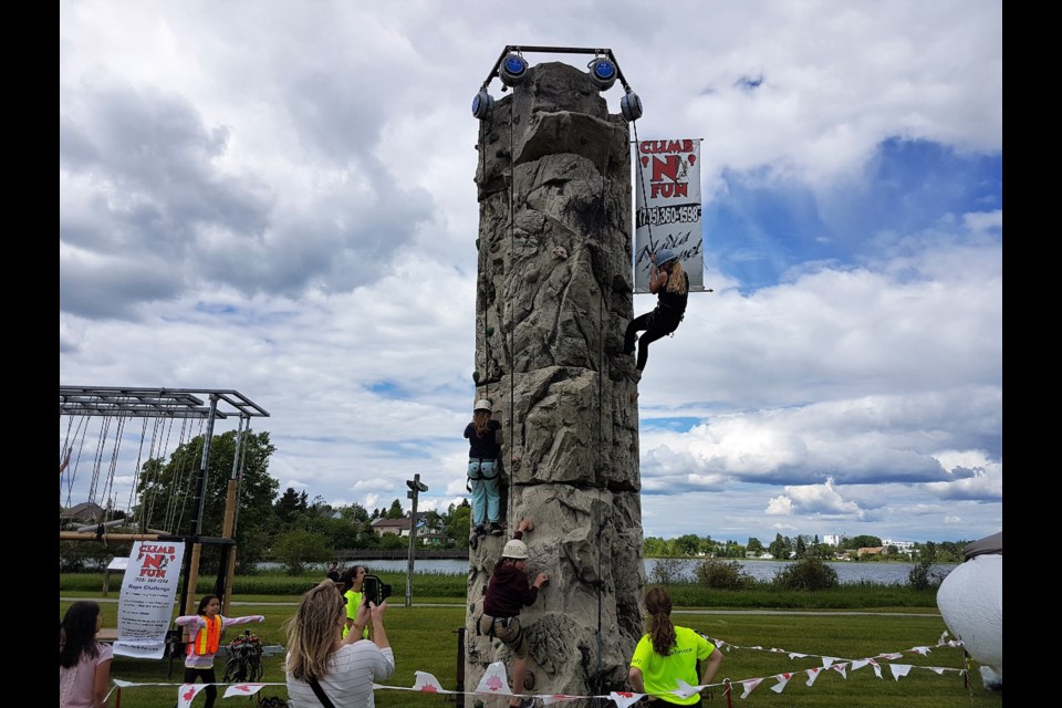 Kids love climbing the rock climbing wall set up at Gillies Lake for Stars and Thunder. Frank Giorno for TimminsToday