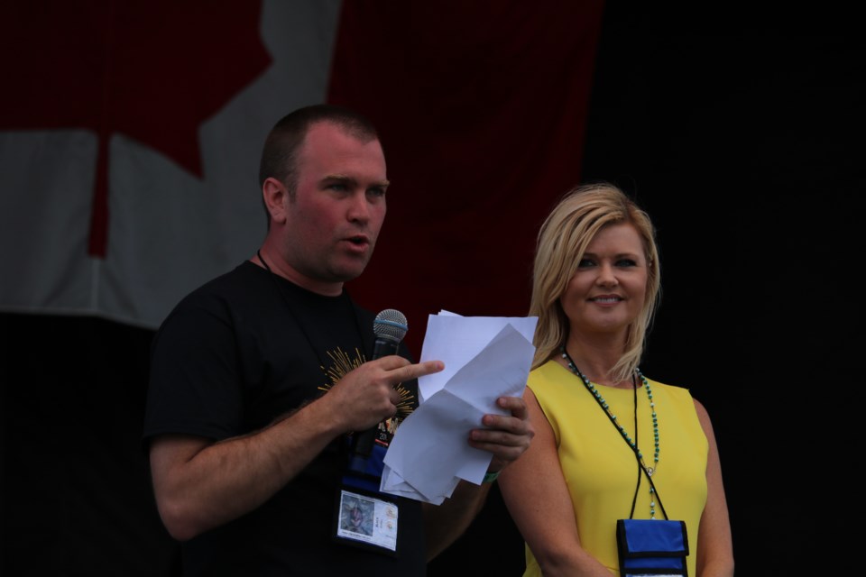 Mayor Steve Black, joined by singer/songwriter Beverley Mahood, addresses the early crowd at Day 1 of the Stars and Thunder festival at Hollinger Park. Andrew Autio for TimminsToday