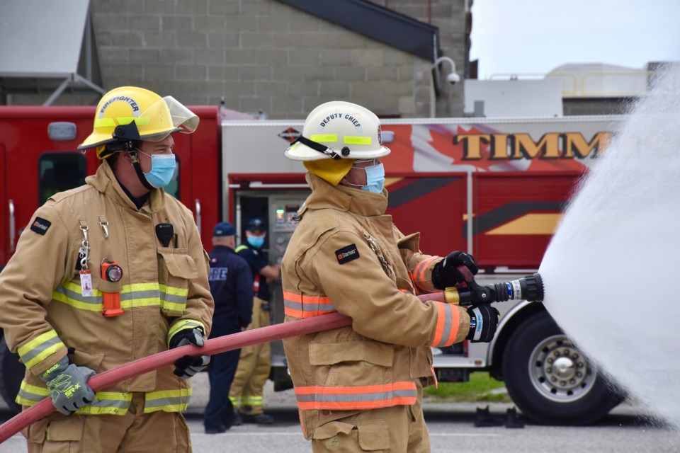 Timmins Police communications coordinator Marc Depatie donned the Timmins Fire Department bunker gear after the fire department collected more food than the police in a friendly food drive challenge.