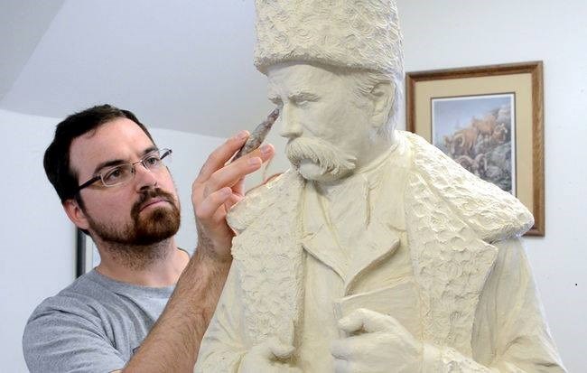 Sculptor Tyler Fauvelle working on a new statue of Taras Shevchenko that will be unveiled on August 22, 2015. Photo provided by the Downtown Business Improvement Association and the Ukrainian Cultural Group in Timmins.