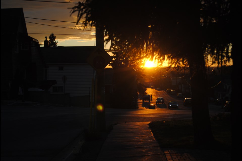 The western sun was ablaze over Timmins on Monday September. Here the trees on Second Avenue by Kobzar Park block all but a pinhole of light creating a chiaroscuro of light and dark. Photo: Frank Giorno, Timminstoday.com