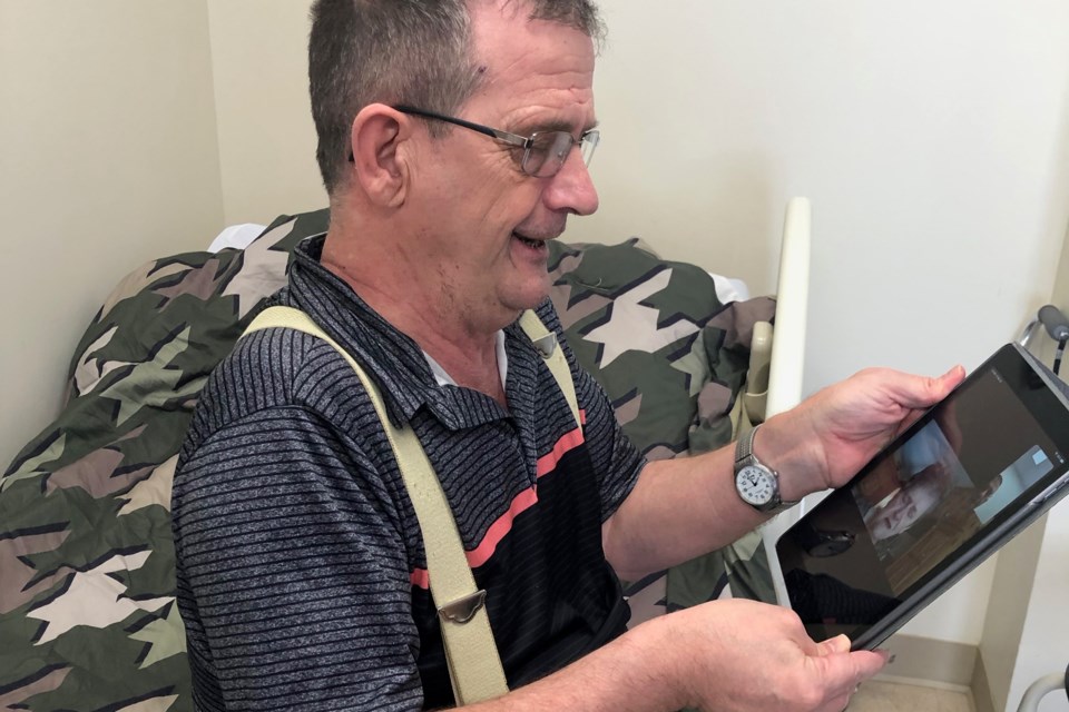 Extendicare Timmins resident Robert St. Denis talks to his sister Cecile Champion. With no visits allowed at longterm care homes, Timmins staff are connecting families through Facebook Messenger chat. Supplied photo