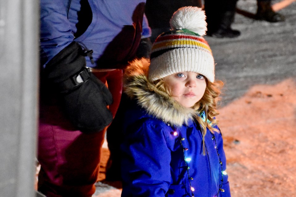 Two-year-old Grace Charbonneau had the honour of helping Timmins Mayor Steve Black light up the community Christmas tree at Hollinger Park. This is the third year for the event that featured holiday music, free hot chocolate and a lot of Christmas cheer. Maija Hoggett/TimminsToday
