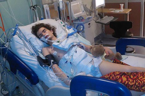 Alexander lies in his hospital bed at CHEO on Dec. 27 after his second surgery. Jessica Trudel for TimminsToday.