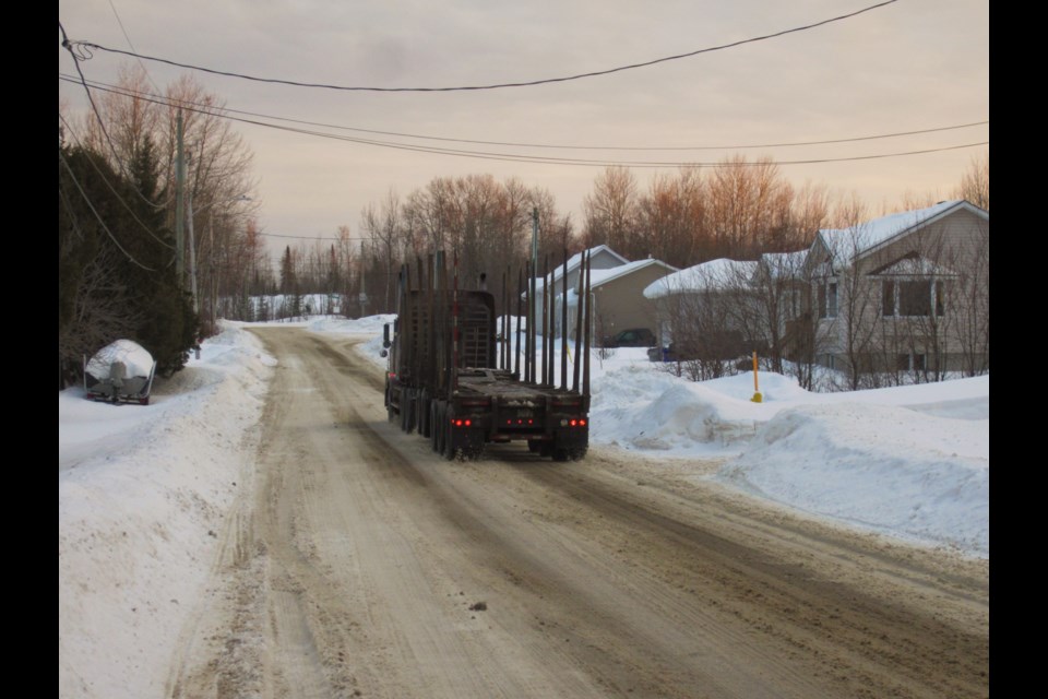 Logging trucks such as this one are a regular occurrence on Tisdale Street in South Porcupine which is becoming a safety concern for many. Andrew Autio for TimminsToday                               