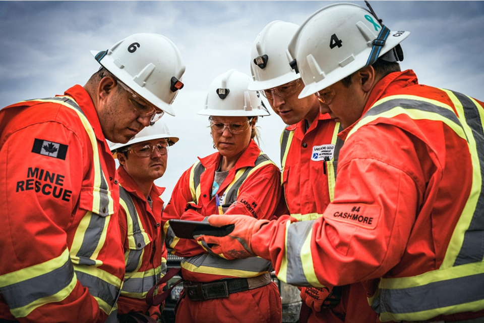 Volunteer mine rescue responders, from left, Serge Roy, Shane Sullivan, Natalie Lafontaine, Brandon Duhan, and Blade Cashmore, from the winning team, Lake Shore Gold Timmins West-Bell Creek Mines, review the information for the mock mine rescue scenario staged at the underground Hagersville Mine. 