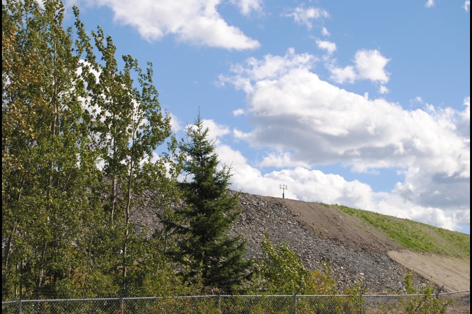 The eastern and northern side of the Hollinger Open Pit berm are fully seeded and of this summer the rock and dust berm looked like a hillside. The west side planted later is slowly catching up. Photo: Frank Giorno, Timminstoday.com 