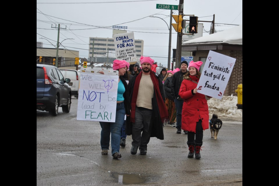 Timmins women march along Algonquin Blvd. E. to Timmins City Hall in solidarity with the Women's March on Washington against Donald Trump's view of women. Frank Giorno for TimminsToday.