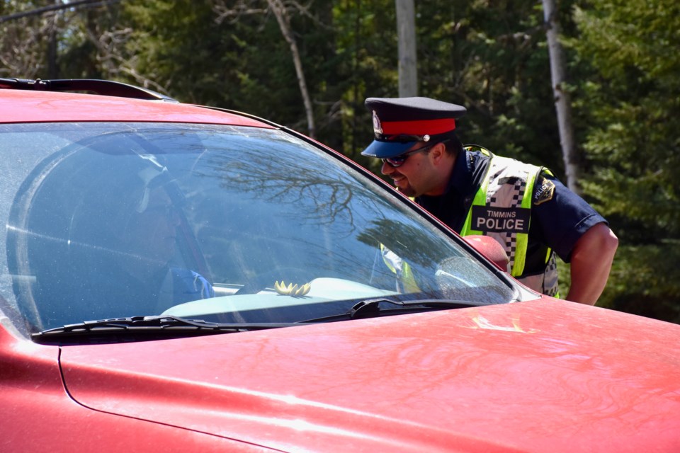 Timmins Police Const. Andre Guertin talks to a driver at a RIDE stop. Maija Hoggett/TimminsToday