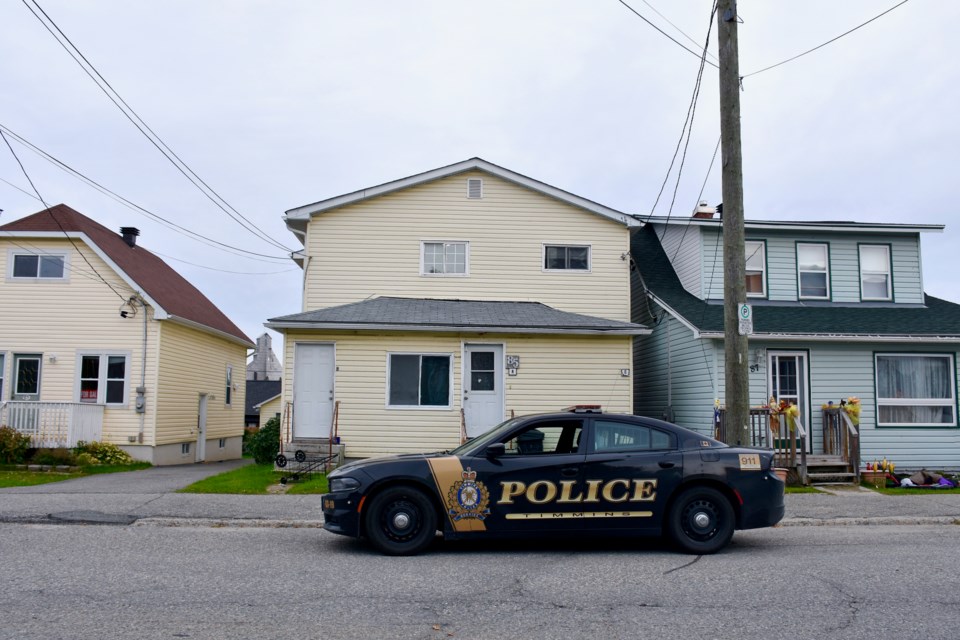 A Timmins Police cruiser outside the building where one person was killed and two injured after a shooting in the early hours of Sept. 23, 2021.