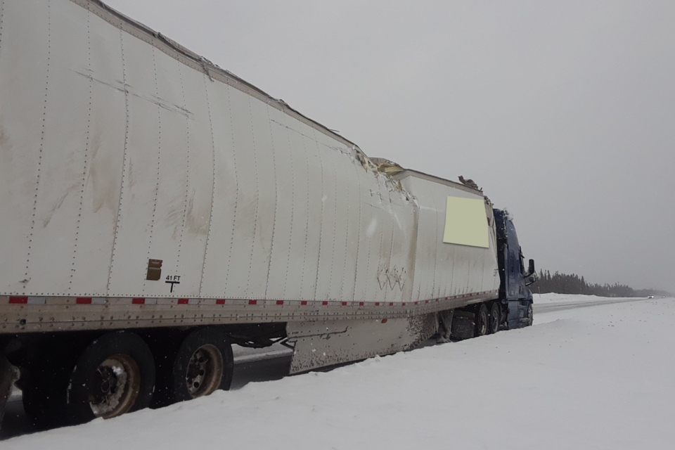 Three people are charged after a transport with a heavily damaged trailer was driven about five fours from Jellicoe to south of Cochrane.
