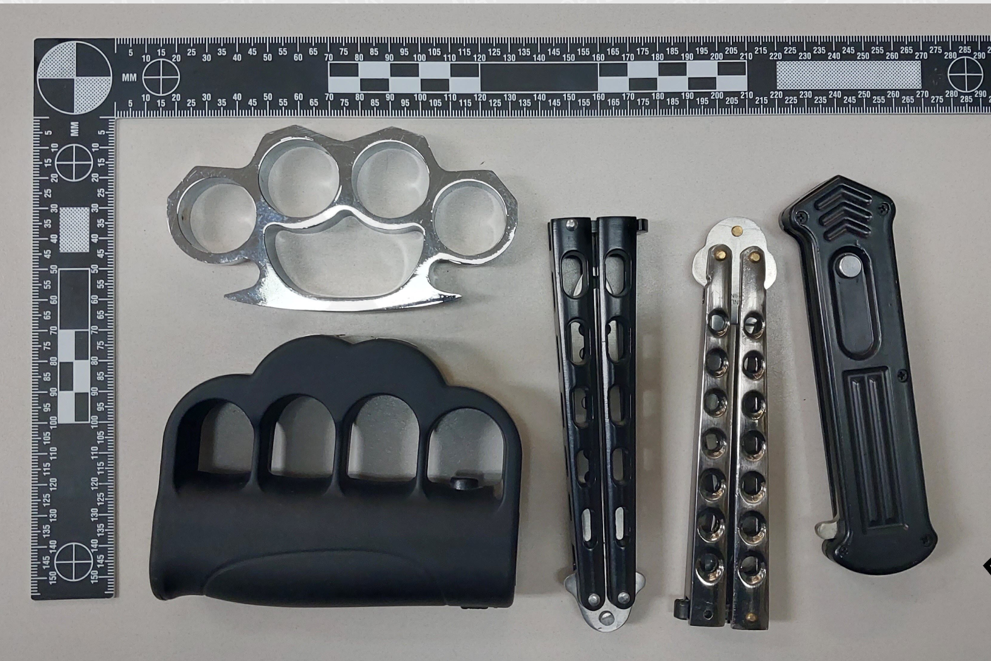 Electrified brass knuckles among banned weapons seized in Cochrane