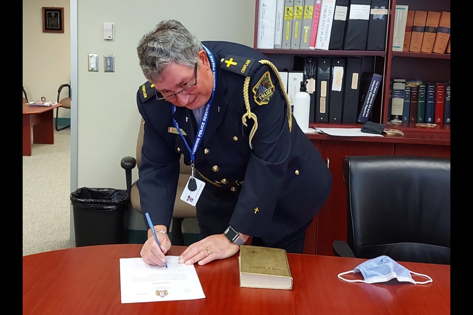 Deacon Dave Smith completes his Oath of Secrecy with Commissioner of Oaths, Stacey Boucher officiating. Supplied photo