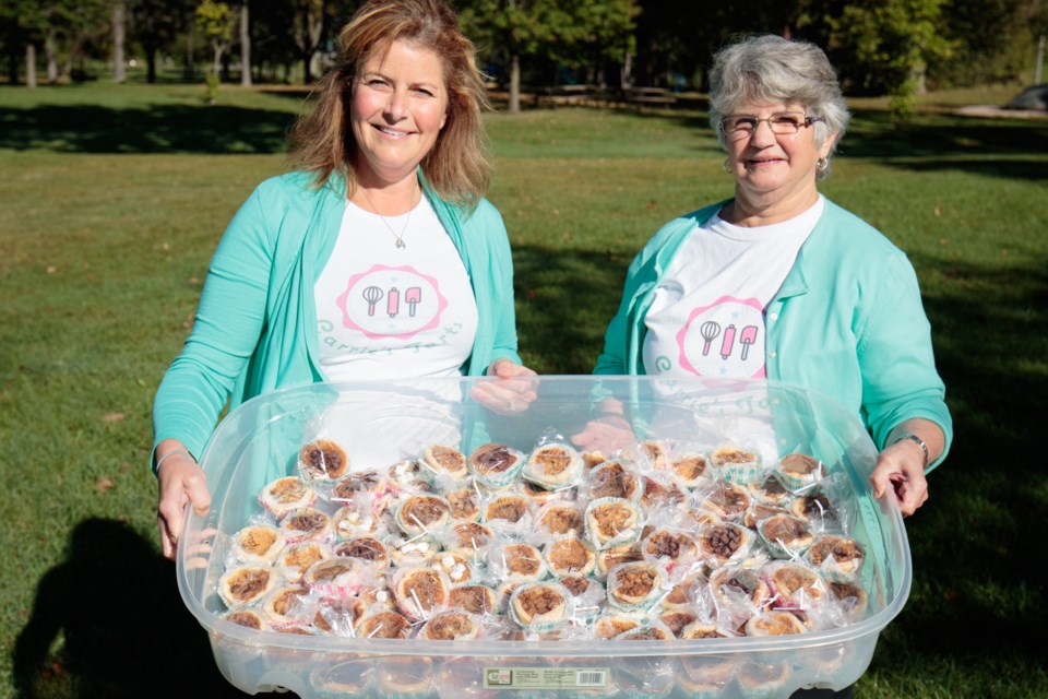 (From left) Carrie Ford and her mom Cheryl Wilson sold butter tarts as 'Carrie's Tarts' at the Sault's first annual Butter Tart Festival on Sunday. Jeff Klassen/SooToday