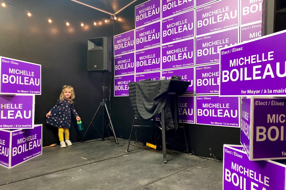 Mayoral candidate Michelle Boileau's daughter plays while waiting for election results to come in.