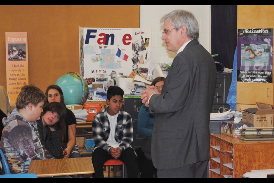The Timmins High civics class was eager to talk about controversial issues, but before they did, MP Charlie Angus gave them a civics lesson they will remember, by tying the political process and political decision making to they issue in their lives as they enter post-secondary education: massive and unnatural student debt. Photo by Frank Giorno, Timminstoday staff