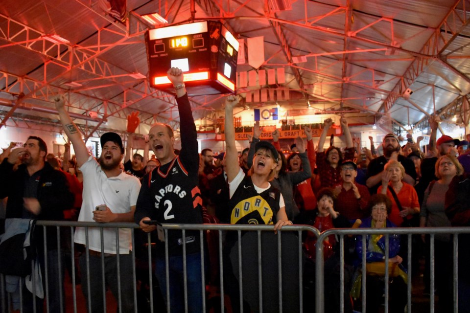Fans celebrate the Raptors first NBA title at the Jurassic Park viewing party in Timmins. Maija Hoggett/TimminsToday