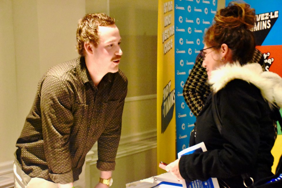 Tyler Smith talks to people after delivering a speech to a packed room at the Porcupine Dante Club.