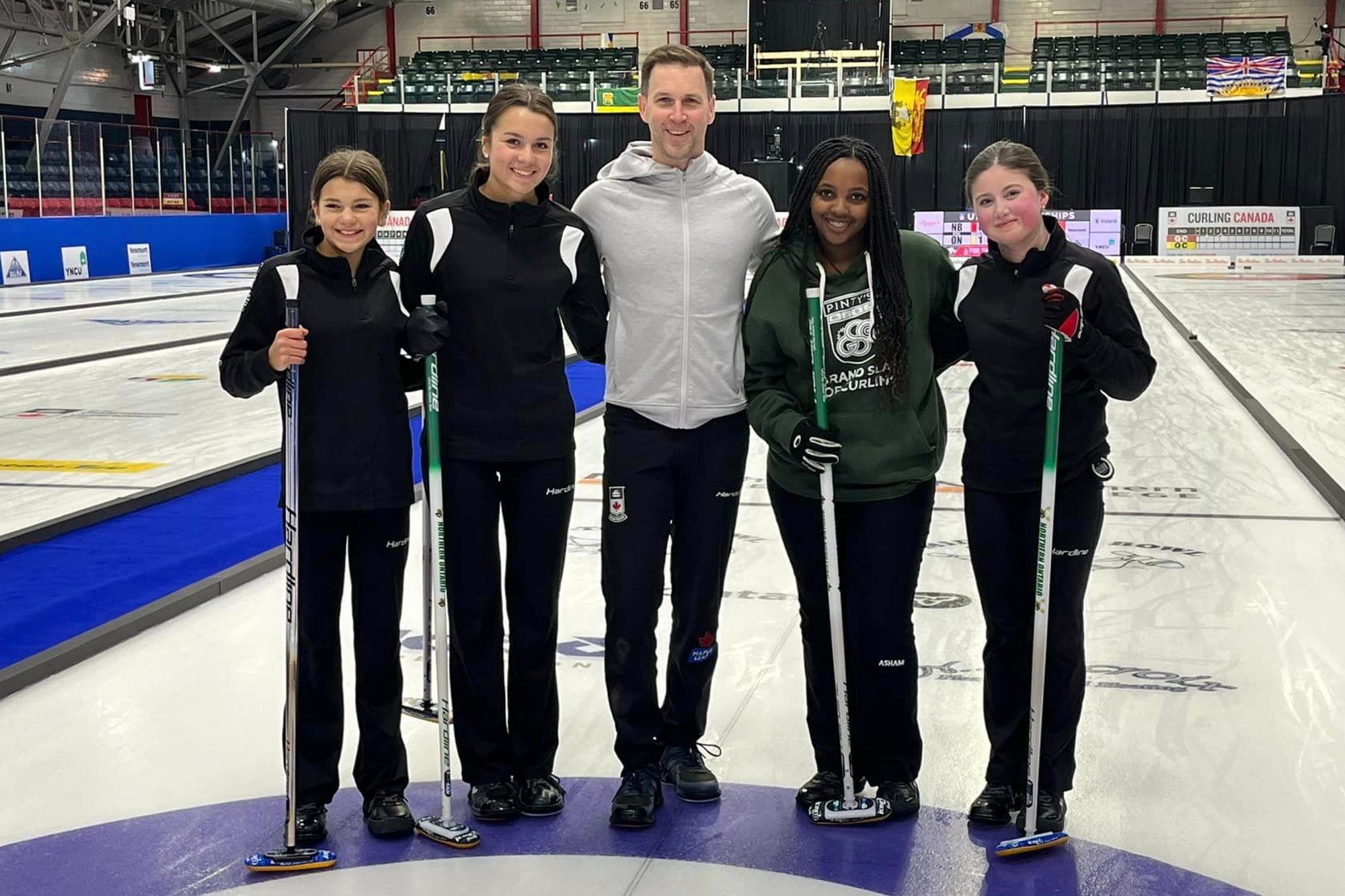 Local curling team throws rocks with Olympian