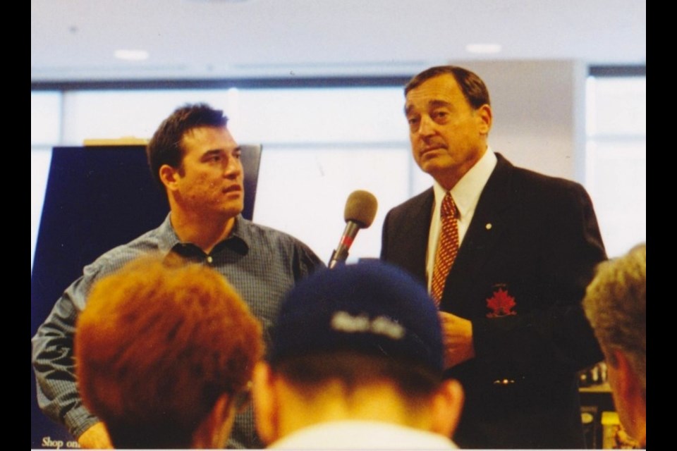 Frank Mahovlich (right) in 2000 at the Indigo Bookstore (Toronto) launch of "The Big M" written by his son Ted Mahovlich. Frank Giorno for TimminsToday.