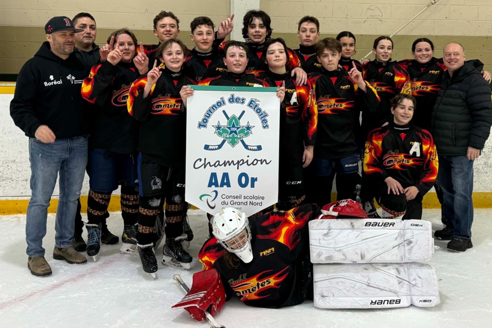 École Jean-Paul II from Val Caron celebrates their gold medal win in the AA Division of the Tournois des Étoiles, the annual Conseil scolaire du Grand Nord hockey competition.