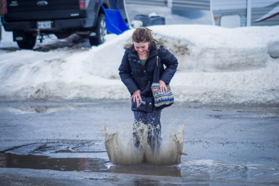 Finding a puddle to splash around in is easy as the winter snow slowly melts. Dillon Tilley for TimminsToday