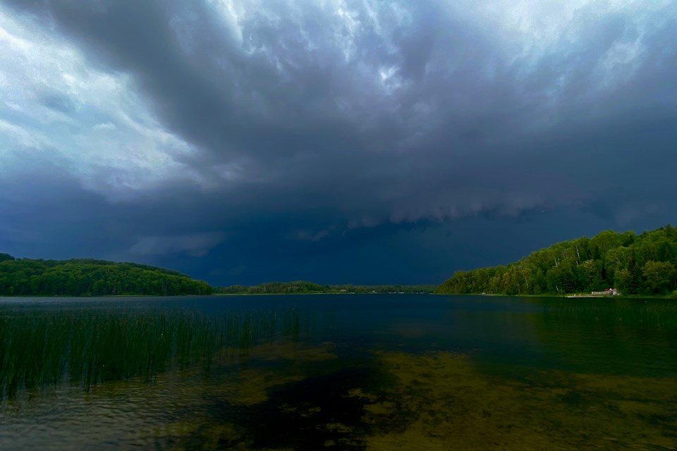The storm July 5, 2021 rolls in over a lake.