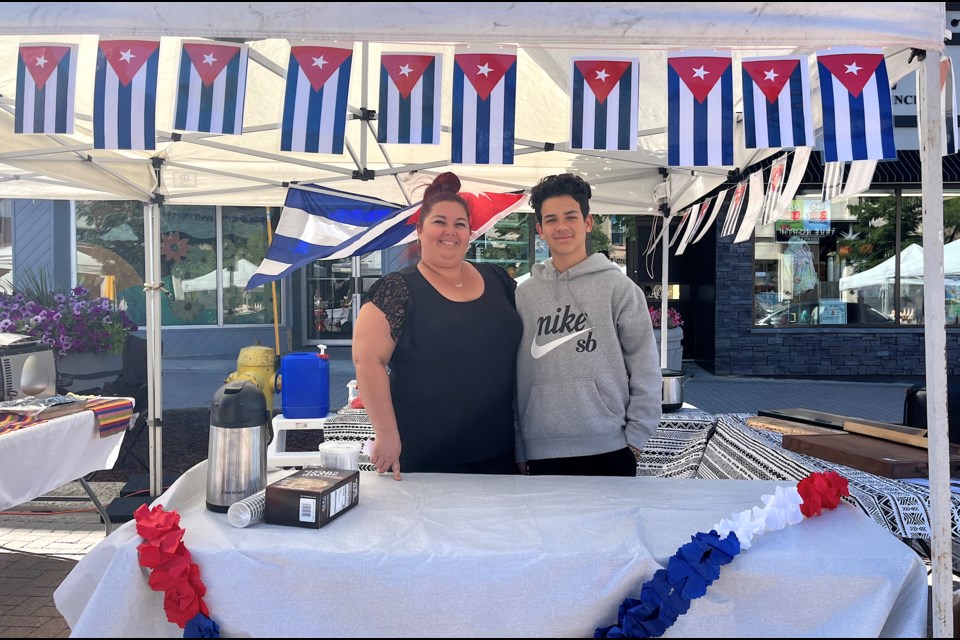 La Cubana in Timmins owner Yadira Rodriguez and her son Jaykob Cruz serve up Cuban-style pulled pork sandwiches every Thursday at the Urban Park Farmers' Market in Downtown Timmins.