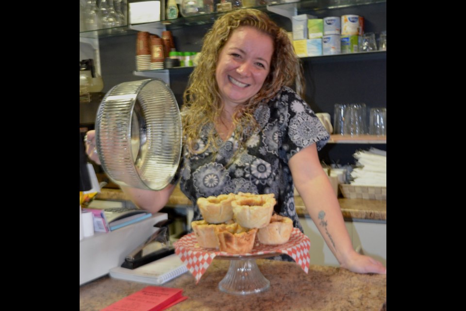Restaurant Nadeau owner Julie Therrien shows off the homemade butter tarts available at her business. The restaurant recently extended its hours Thursday through Saturday to offer dinner and take out, including delivery. Wayne Snider for TimminsToday