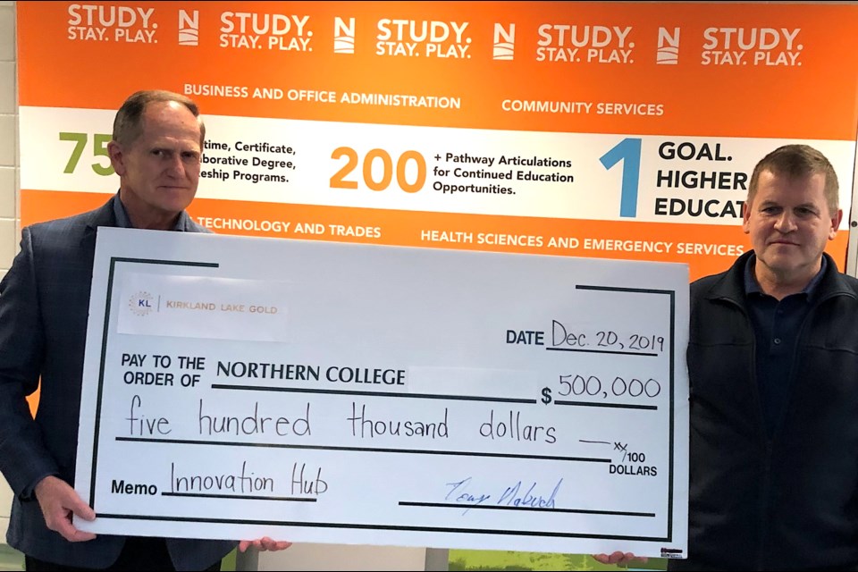 Northern College receives a $500,000 donation from Kirkland Lake Gold for development of its new 24,000-square-foot Innovation Hub. Northern College President and CEO Dr. Fred Gibbons, left, receives the cheque from Kirkland Lake Gold President and CEO Tony Makuch. The facility, which will feature eight shops, is slated to open in the spring. Wayne Snider for Timmins Today.