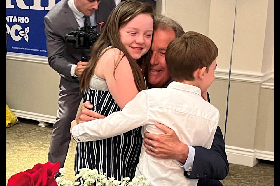 Timmins MPP elect George Pirie gives a big hug to his grandchildren following his win in Timmins on Thursday night.