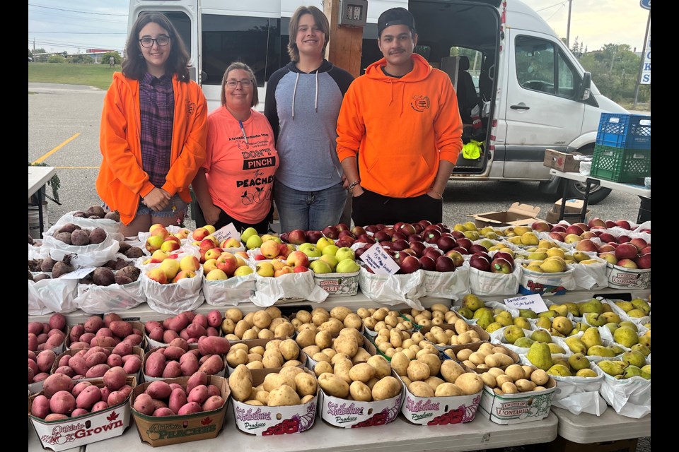 Marion Veens, second from left, and her Sunrise Orchards and Produce crew during a recent visit to the Mountjoy Farmers' Market.