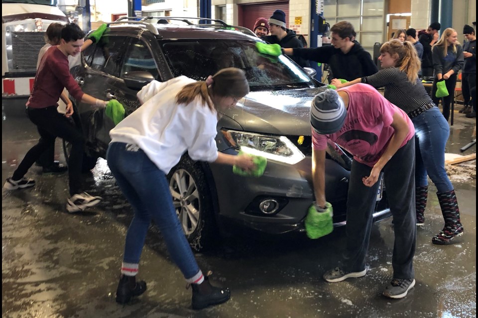 Students and staff from Timmins High & Vocational School spent their Saturday volunteering at a fundraising car wash and barbecue. Funds were collected to help the family of Timmins High student Braedyn Johnstone, who is undergoing cancer treatment. Wayne Snider for Timmins Today.