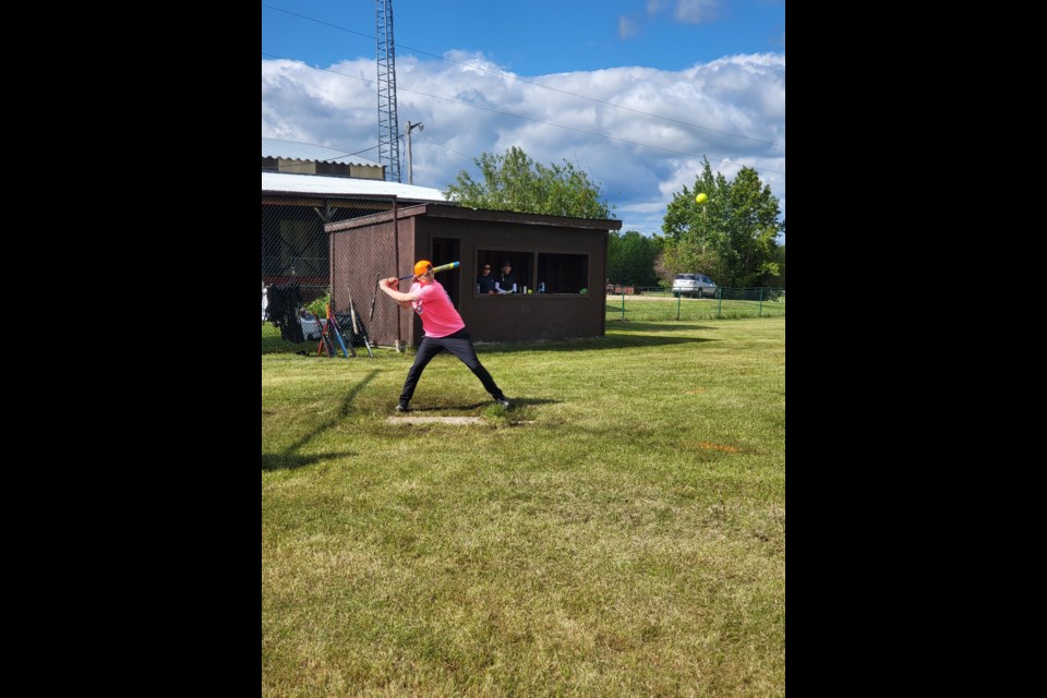 Cole Fedorvich, player with the Masterbatters, gets ready to hit a ball and put on base to score a run later in the game.