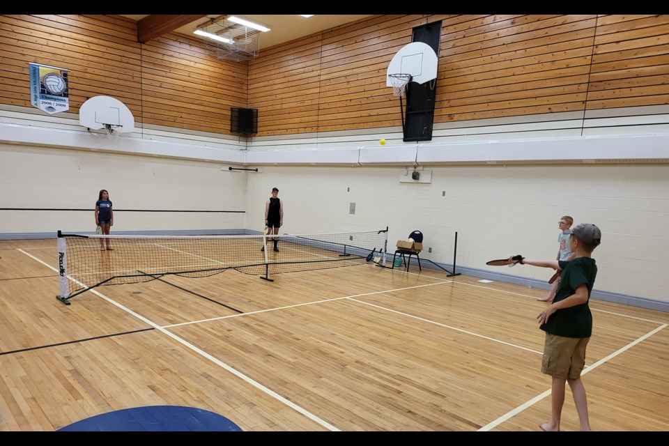 Ryder and Ian Lea battle Morgan Lea and Austin Indenbosch in a pickleball game at the Jarvie Family Day event on July 20