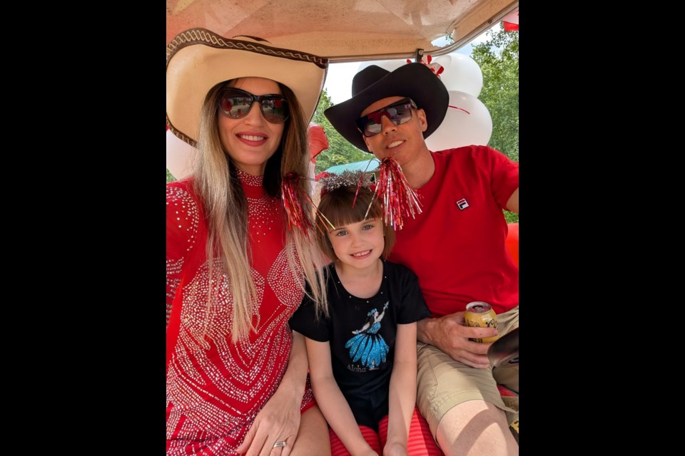 Khrystyna Olineck(left) with Sophia, Wes and  having a fantastic time at the Thunder Lake Canada Day celebration on June 28. Photo Supplied. 